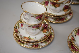 A Royal Albert Old Country Roses part tea set comprising twelve trios, a two tier cake stand, sugar bowl and cream jug. Condition - good